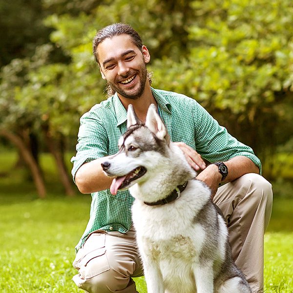 Man With Husky Outside